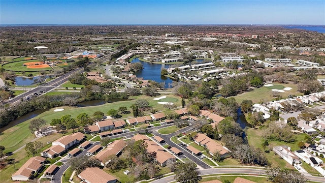 bird's eye view with a residential view, view of golf course, and a water view