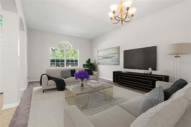 11611 Jordans Landing Ct, Riverview, FL 33569 - carpeted living room featuring a chandelier, arched walkways, baseboards, and tile patterned flooring