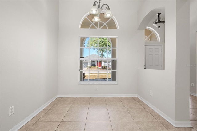 11611 Jordans Landing Ct, Riverview, FL 33569 - unfurnished dining area featuring a chandelier, tile patterned floors, and baseboards