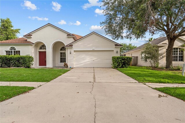 11611 Jordans Landing Ct, Riverview, FL 33569 - single story home with a garage, concrete driveway, a front lawn, and stucco siding