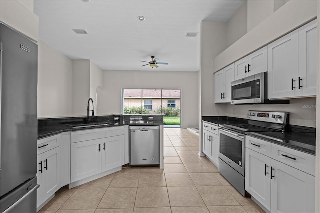 11611 Jordans Landing Ct, Riverview, FL 33569 - kitchen featuring appliances with stainless steel finishes, a sink, a ceiling fan, and white cabinetry