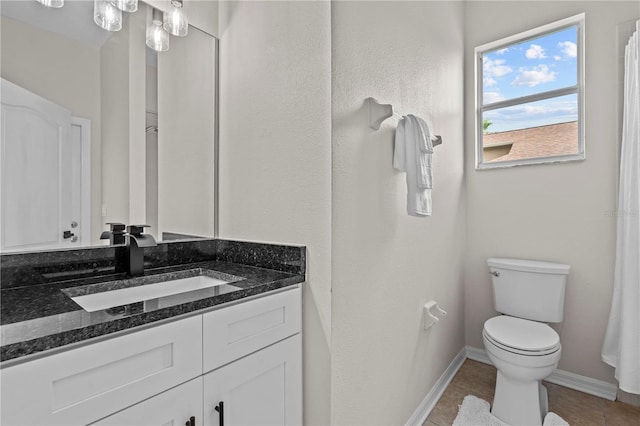 11611 Jordans Landing Ct, Riverview, FL 33569 - bathroom featuring toilet, vanity, baseboards, and tile patterned flooring