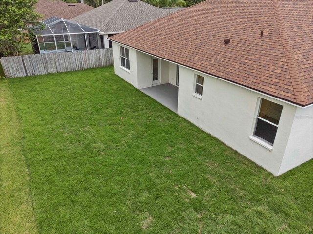 11611 Jordans Landing Ct, Riverview, FL 33569 - back of property with roof with shingles, stucco siding, and a patio
