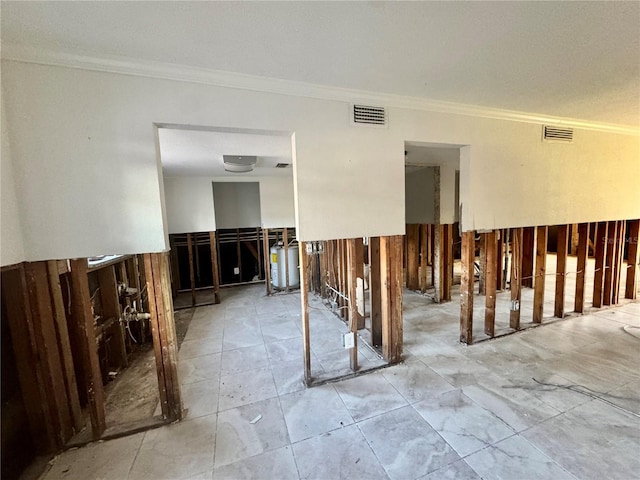 empty room with visible vents and ornamental molding