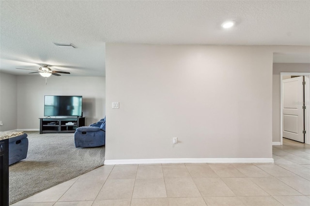 8034 Broad Pointe Dr, Zephyrhills, FL 33540 - living area with a textured ceiling, a ceiling fan, and light tile patterned floors