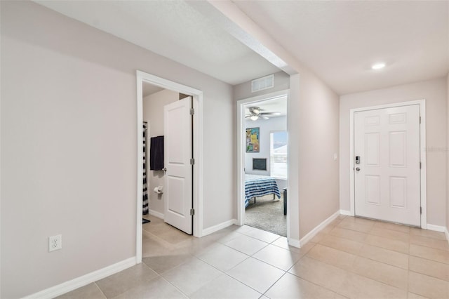 8034 Broad Pointe Dr, Zephyrhills, FL 33540 - entryway with light tile patterned floors and a ceiling fan