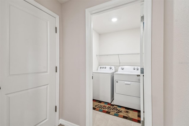 8034 Broad Pointe Dr, Zephyrhills, FL 33540 - laundry room featuring washing machine and dryer and tile patterned flooring