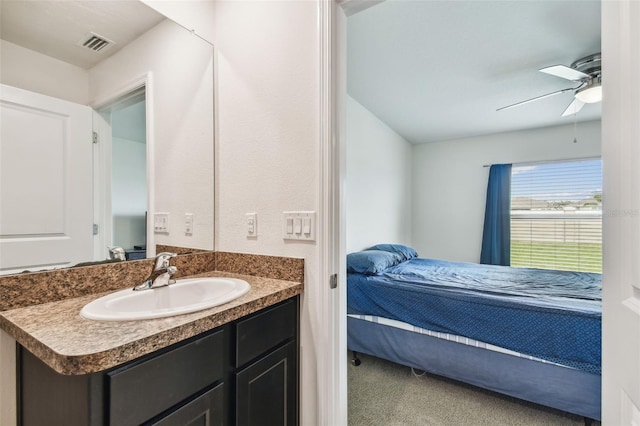 8034 Broad Pointe Dr, Zephyrhills, FL 33540 - ensuite bathroom with vanity and a ceiling fan