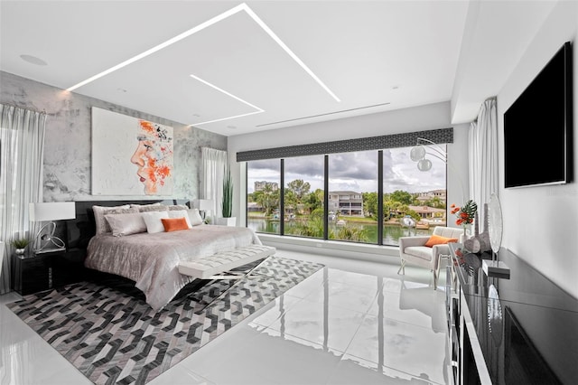 bedroom featuring marble finish floor