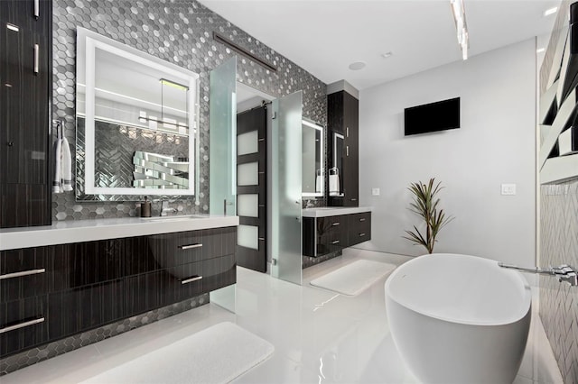 full bath with a freestanding bath and vanity