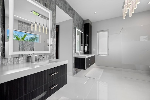 full bath featuring tile patterned flooring, two vanities, and a sink