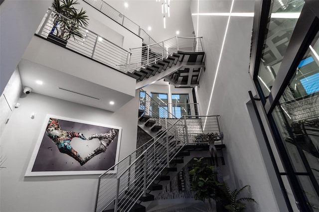 staircase with a high ceiling