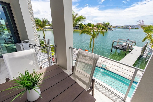 balcony featuring a water view