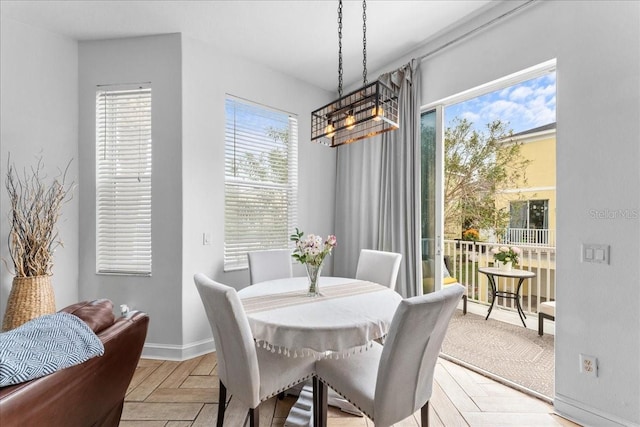 dining space featuring baseboards