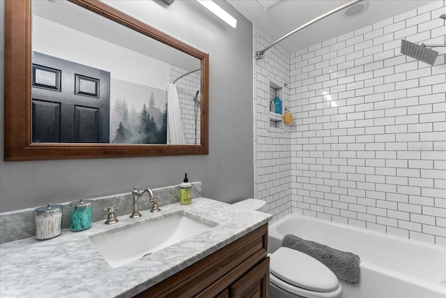 bathroom with toilet, shower / bath combo, and vanity