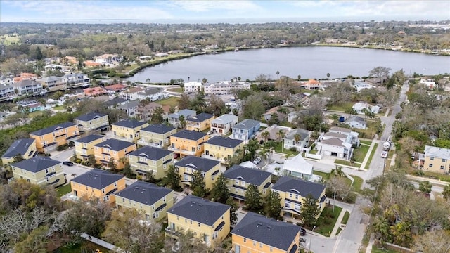 drone / aerial view featuring a residential view and a water view