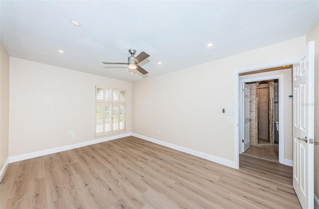 unfurnished room featuring recessed lighting, baseboards, and light wood finished floors