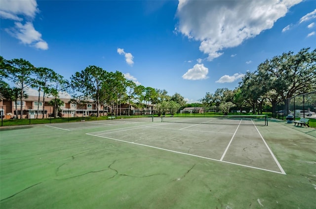 view of tennis court with fence