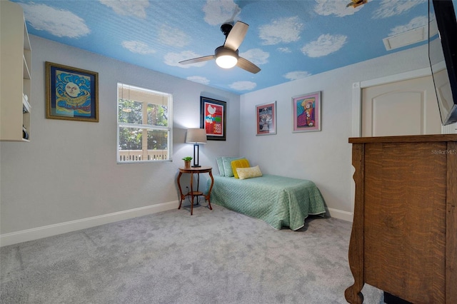 bedroom featuring ceiling fan, baseboards, and light colored carpet