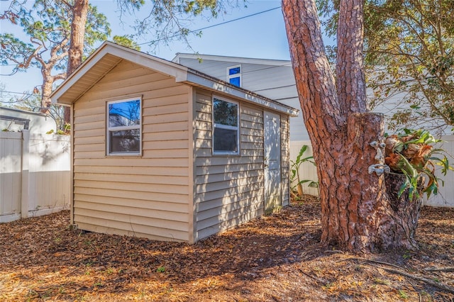 view of shed with fence