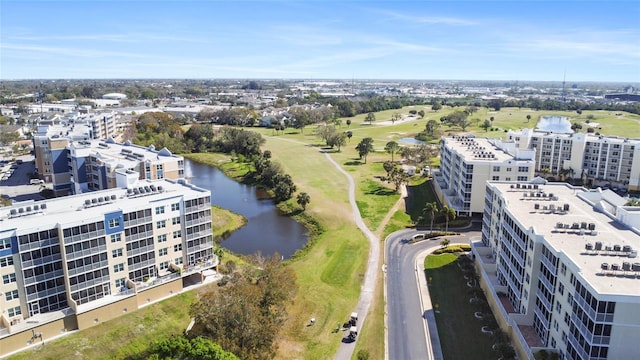 bird's eye view featuring a water view and view of golf course