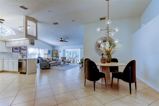 dining space featuring lofted ceiling, light tile patterned floors, and visible vents