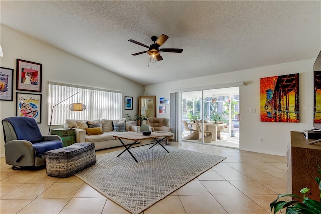 living area featuring light tile patterned floors, lofted ceiling, a healthy amount of sunlight, and ceiling fan