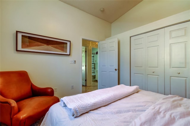 bedroom featuring a closet and vaulted ceiling