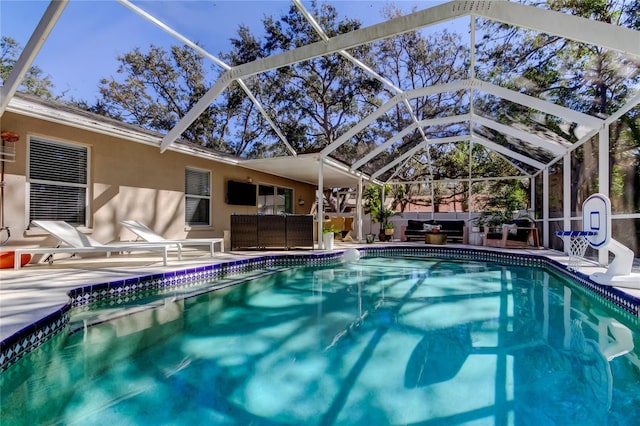 outdoor pool featuring outdoor lounge area, a lanai, and a patio area