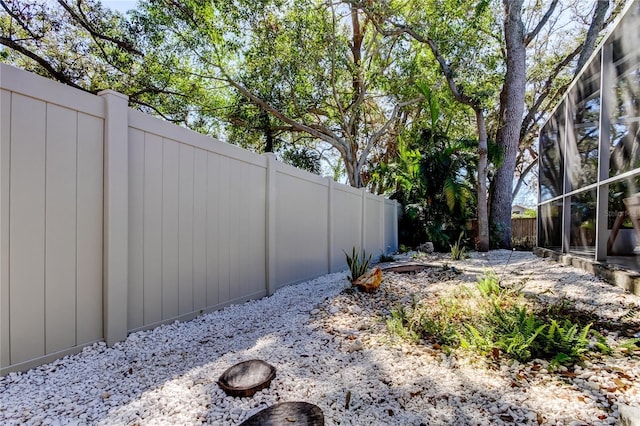 view of yard with a fenced backyard