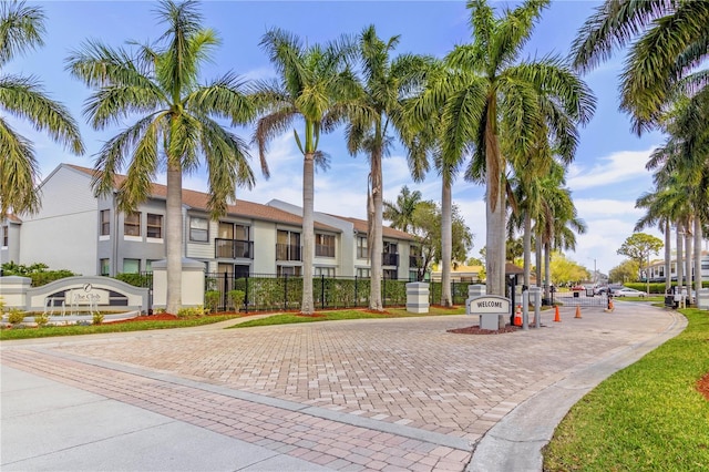 view of property with a fenced front yard and a residential view