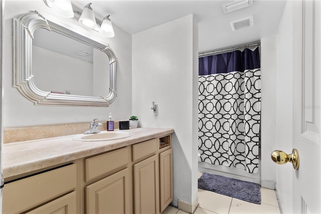 bathroom with tile patterned flooring, visible vents, and vanity