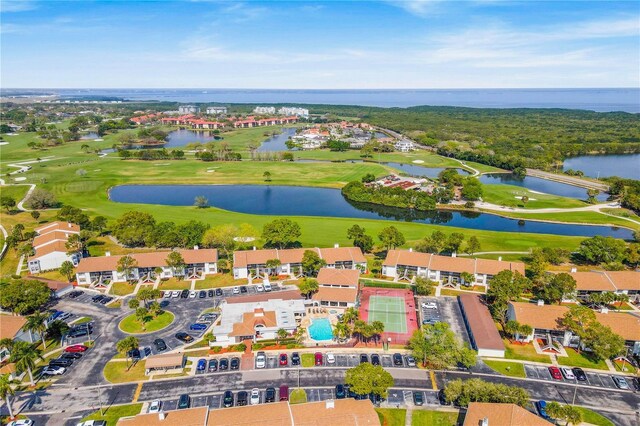 aerial view with view of golf course and a water view