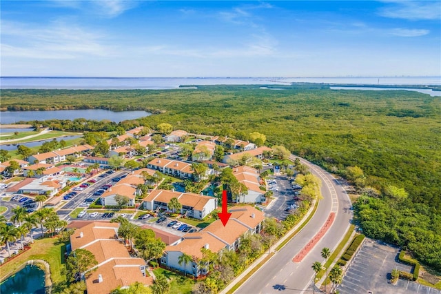 bird's eye view featuring a water view and a residential view