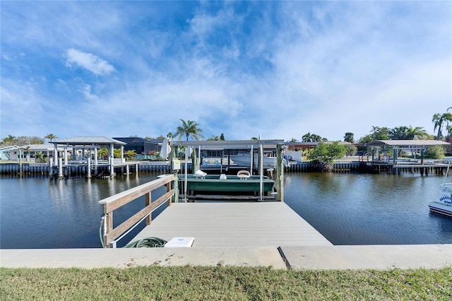 view of dock featuring a water view and boat lift