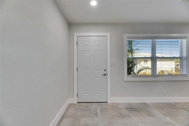 entrance foyer featuring baseboards