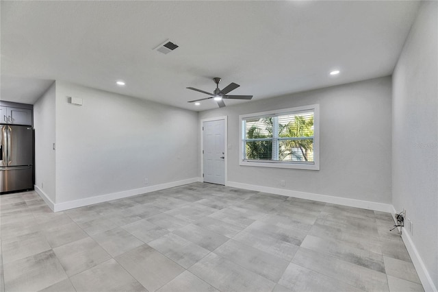 empty room with baseboards, visible vents, ceiling fan, and recessed lighting