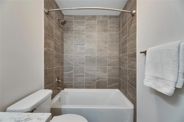 full bathroom with toilet and  shower combination