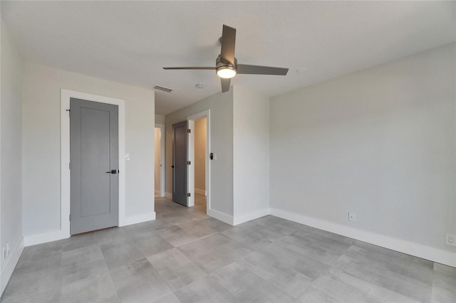 unfurnished bedroom with baseboards, visible vents, and a ceiling fan