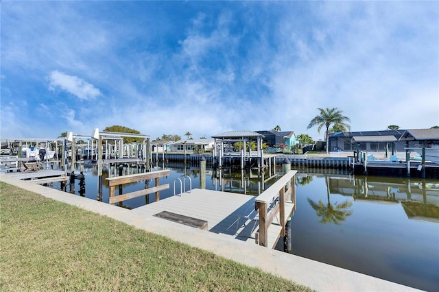 dock area with a water view and boat lift