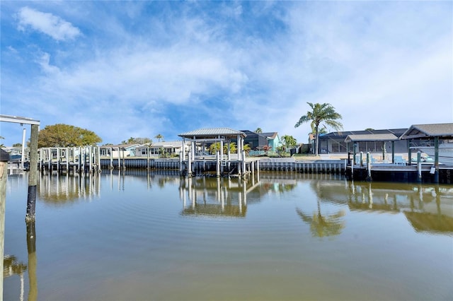 dock area featuring a water view and a residential view