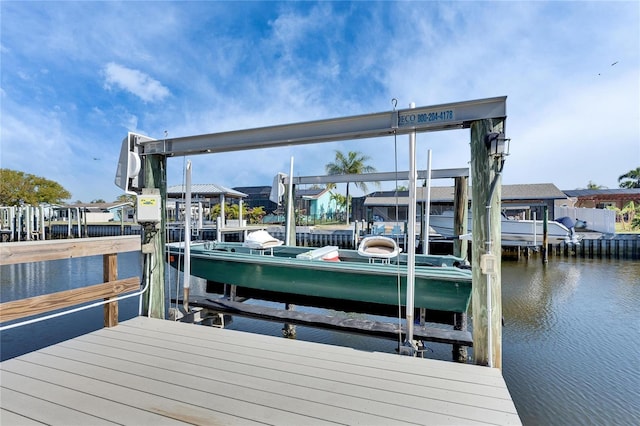 view of dock featuring a water view and boat lift