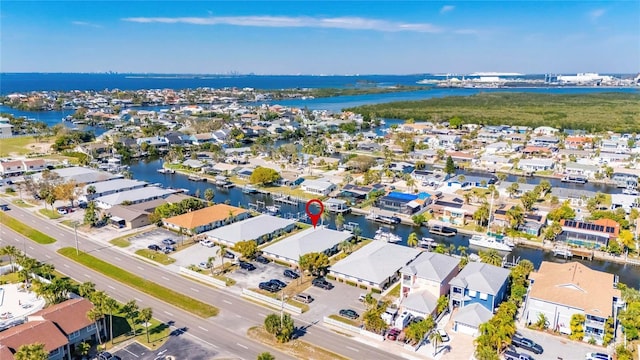 bird's eye view with a water view and a residential view