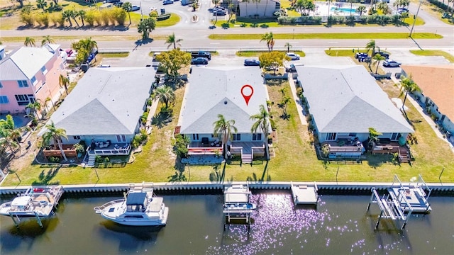 aerial view featuring a residential view and a water view