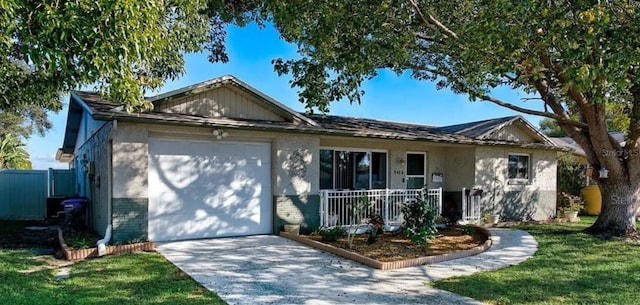 9436 Glen Moor Ln, Port Richey, FL 34668 - single story home with brick siding, a porch, an attached garage, driveway, and a front lawn