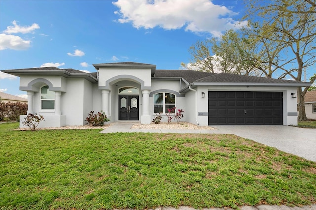 view of front facade featuring french doors, stucco siding, concrete driveway, an attached garage, and a front yard