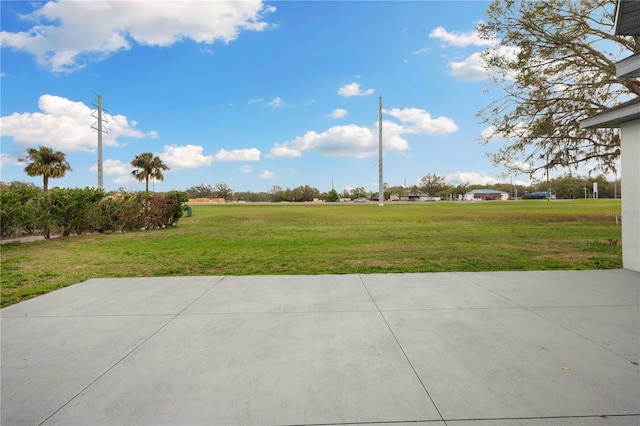 exterior space with a lawn and a patio