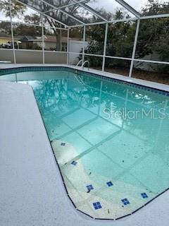 outdoor pool with glass enclosure