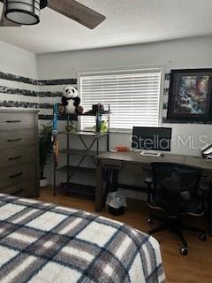 bedroom featuring dark wood-style flooring