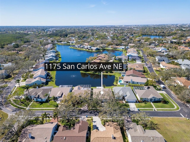 drone / aerial view featuring a water view and a residential view